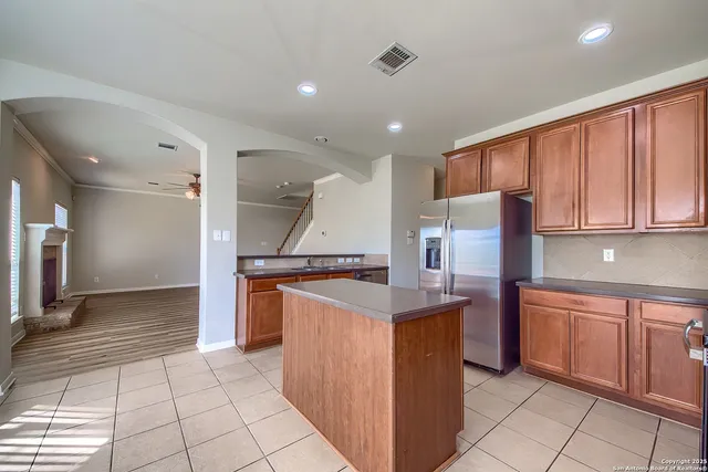 a kitchen with stainless steel appliances a sink and a refrigerator