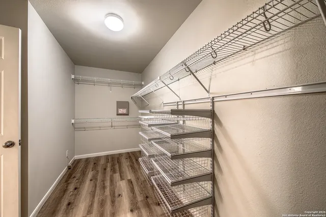 a view of a room with racks on the wall