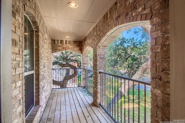 a view of a balcony with wooden floor