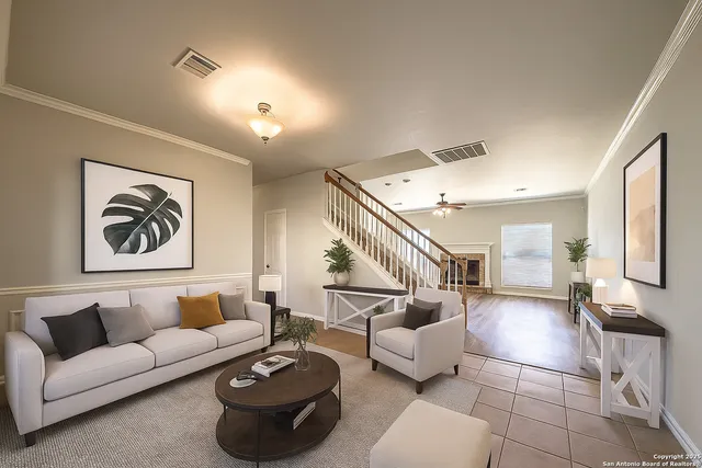 a living room with furniture and a painting