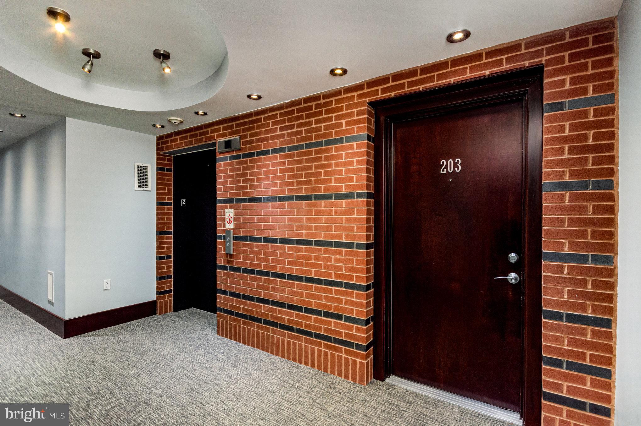 1450 Church Street Northwest, Unit 203 Washington, DC 20005 - Photo 2 of 35 a view of a hallway with closet