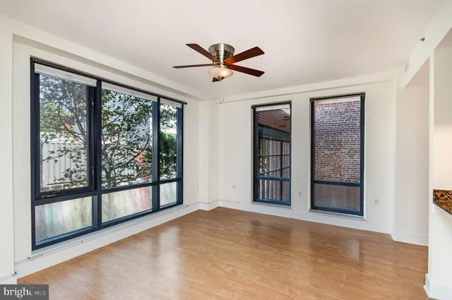 a view of an empty room with a window
