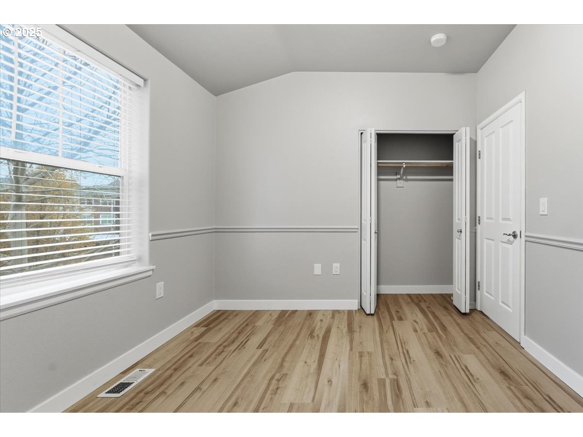 10835 Southwest Huntington Avenue Portland, OR 97223 - Photo 29 of 40 a view of wooden floor in an empty room