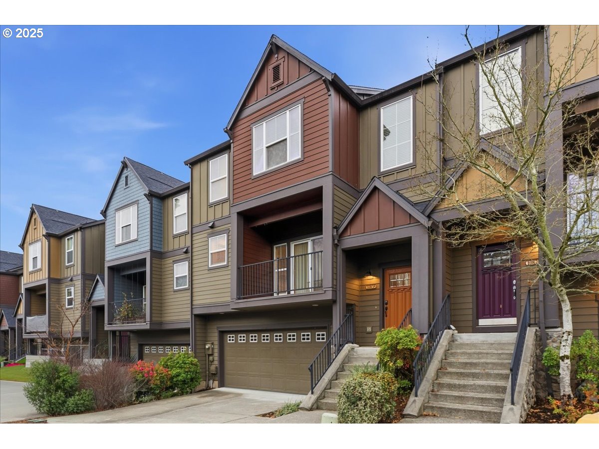 10835 Southwest Huntington Avenue Portland, OR 97223 - Photo 3 of 40 a front view of a house with glass windows