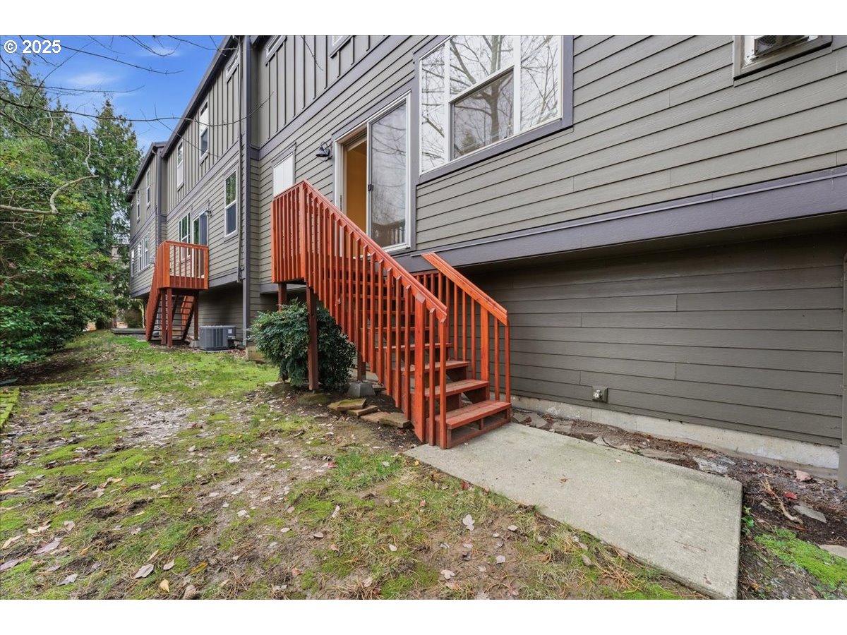 10835 Southwest Huntington Avenue Portland, OR 97223 - Photo 35 of 40 a view of a house with wooden fence