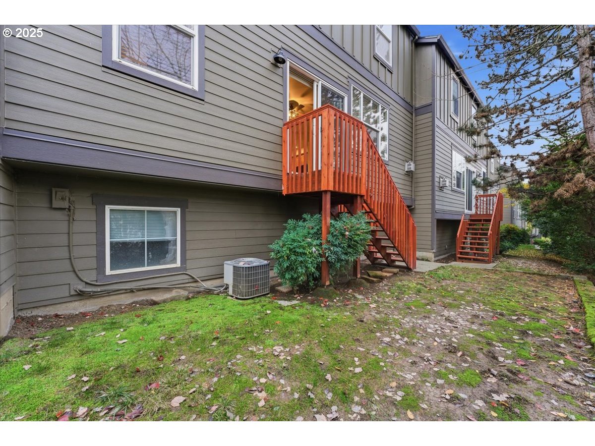 10835 Southwest Huntington Avenue Portland, OR 97223 - Photo 37 of 40 a view of a house with a yard and sitting area