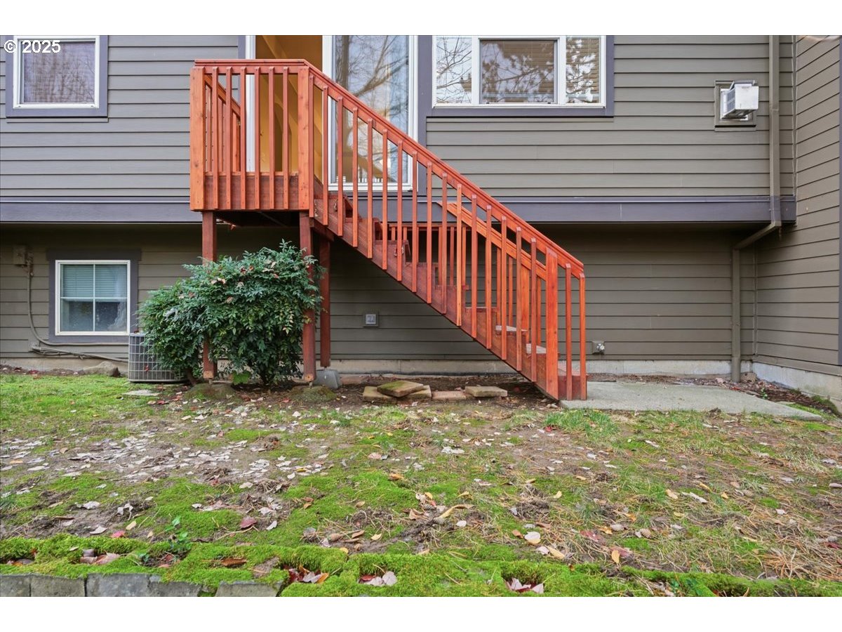 10835 Southwest Huntington Avenue Portland, OR 97223 - Photo 38 of 40 a view of a house with a yard