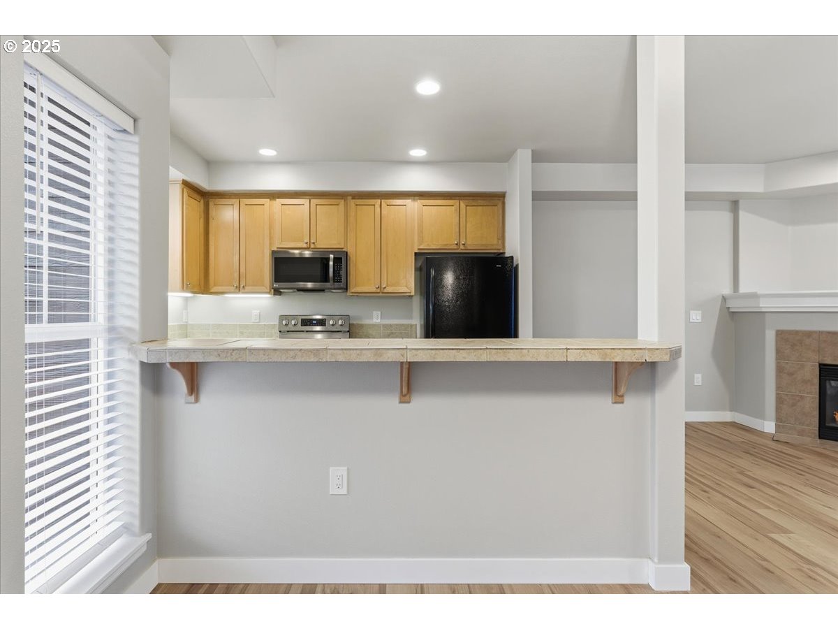 10835 Southwest Huntington Avenue Portland, OR 97223 - Photo 9 of 40 a view of kitchen with stainless steel appliances cabinets