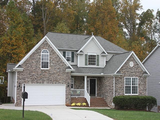 164 Mickleson Ridge Drive Raleigh, NC 27603 - Photo 2 of 25 a front view of a house with a yard and garage