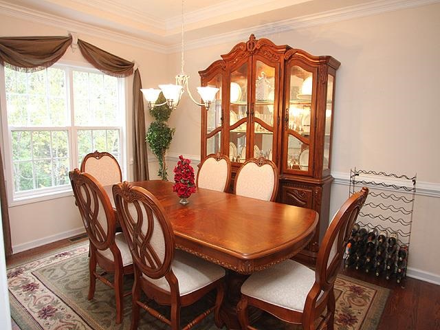 164 Mickleson Ridge Drive Raleigh, NC 27603 - Photo 12 of 25 a view of a dining room with furniture and a window