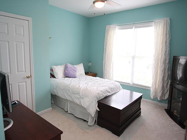 164 Mickleson Ridge Drive Raleigh, NC 27603 - Photo 16 of 25 a bedroom with a bed window and a flat tv screen