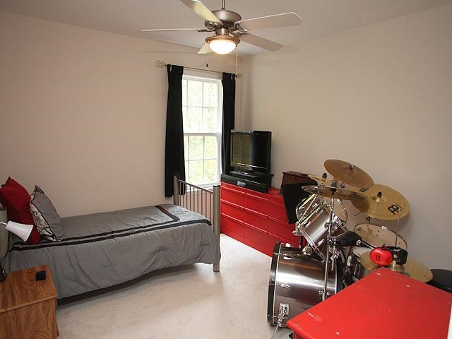 164 Mickleson Ridge Drive Raleigh, NC 27603 - Photo 17 of 25 a room with gym equipment and a flat screen tv