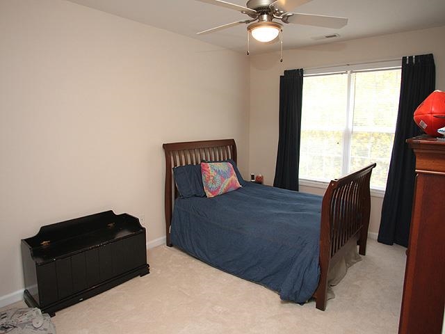 164 Mickleson Ridge Drive Raleigh, NC 27603 - Photo 18 of 25 a bedroom with a bed and window