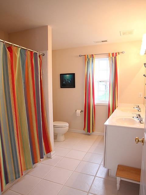 164 Mickleson Ridge Drive Raleigh, NC 27603 - Photo 20 of 25 a bathroom with a sink a toilet and shower