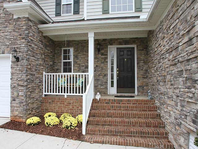 164 Mickleson Ridge Drive Raleigh, NC 27603 - Photo 3 of 25 front view of a brick house