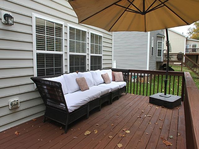 164 Mickleson Ridge Drive Raleigh, NC 27603 - Photo 22 of 25 a view of a wooden deck with furniture