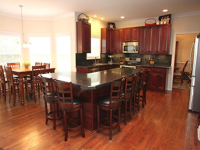 164 Mickleson Ridge Drive Raleigh, NC 27603 - Photo 6 of 25 a large kitchen with a table and chairs