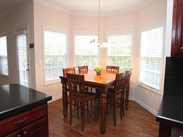 164 Mickleson Ridge Drive Raleigh, NC 27603 - Photo 7 of 25 a view of a dining room with furniture window and wooden floor