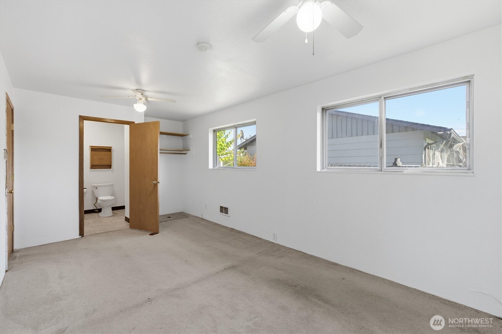 4759 Windemere Street Longview, WA 98632 - Photo 14 of 38 an empty room with windows and closet