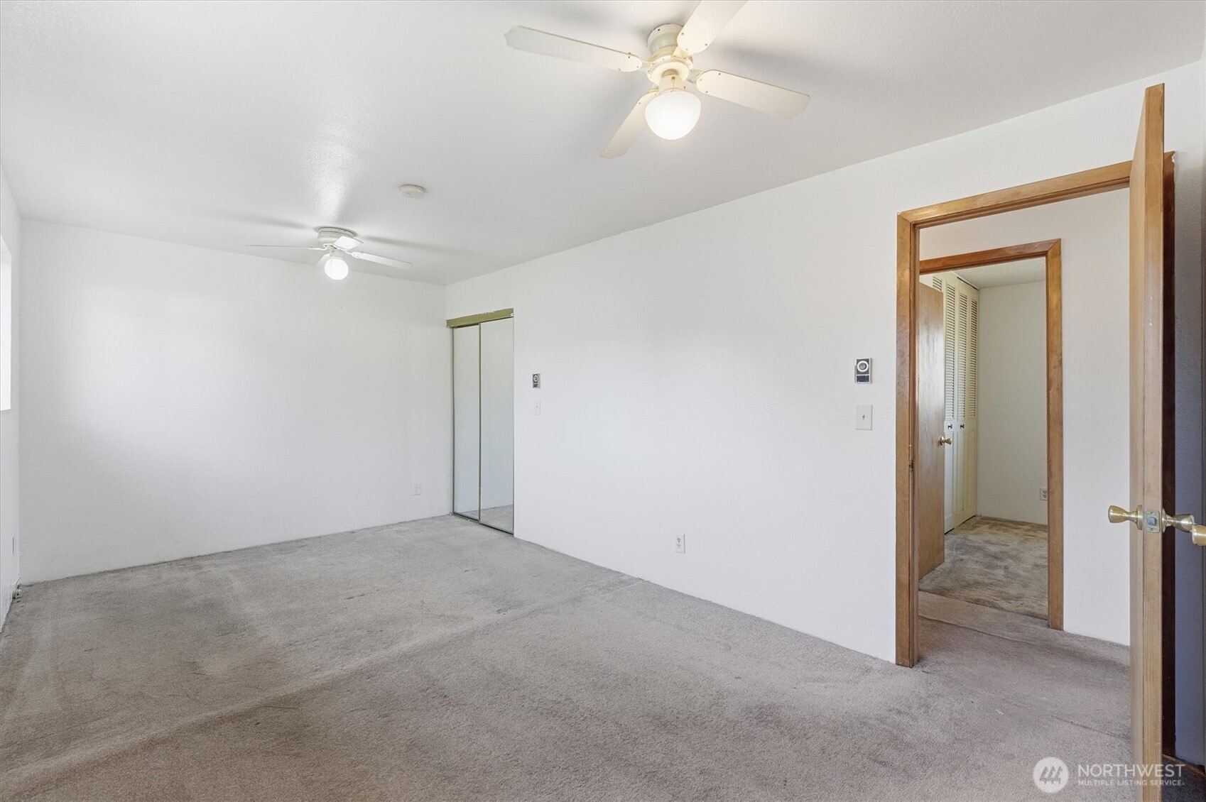 4759 Windemere Street Longview, WA 98632 - Photo 16 of 38 a view of an empty room with a ceiling fan