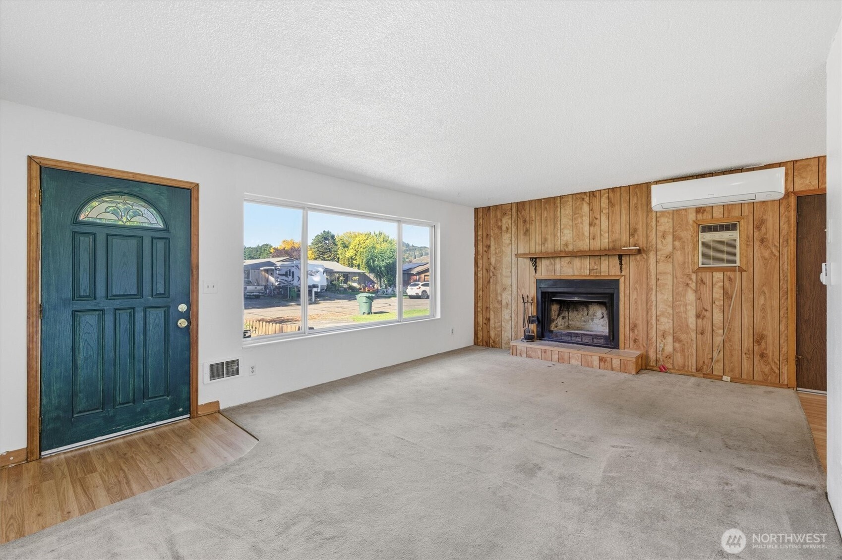 4759 Windemere Street Longview, WA 98632 - Photo 2 of 38 an empty room with windows fire place and a fireplace