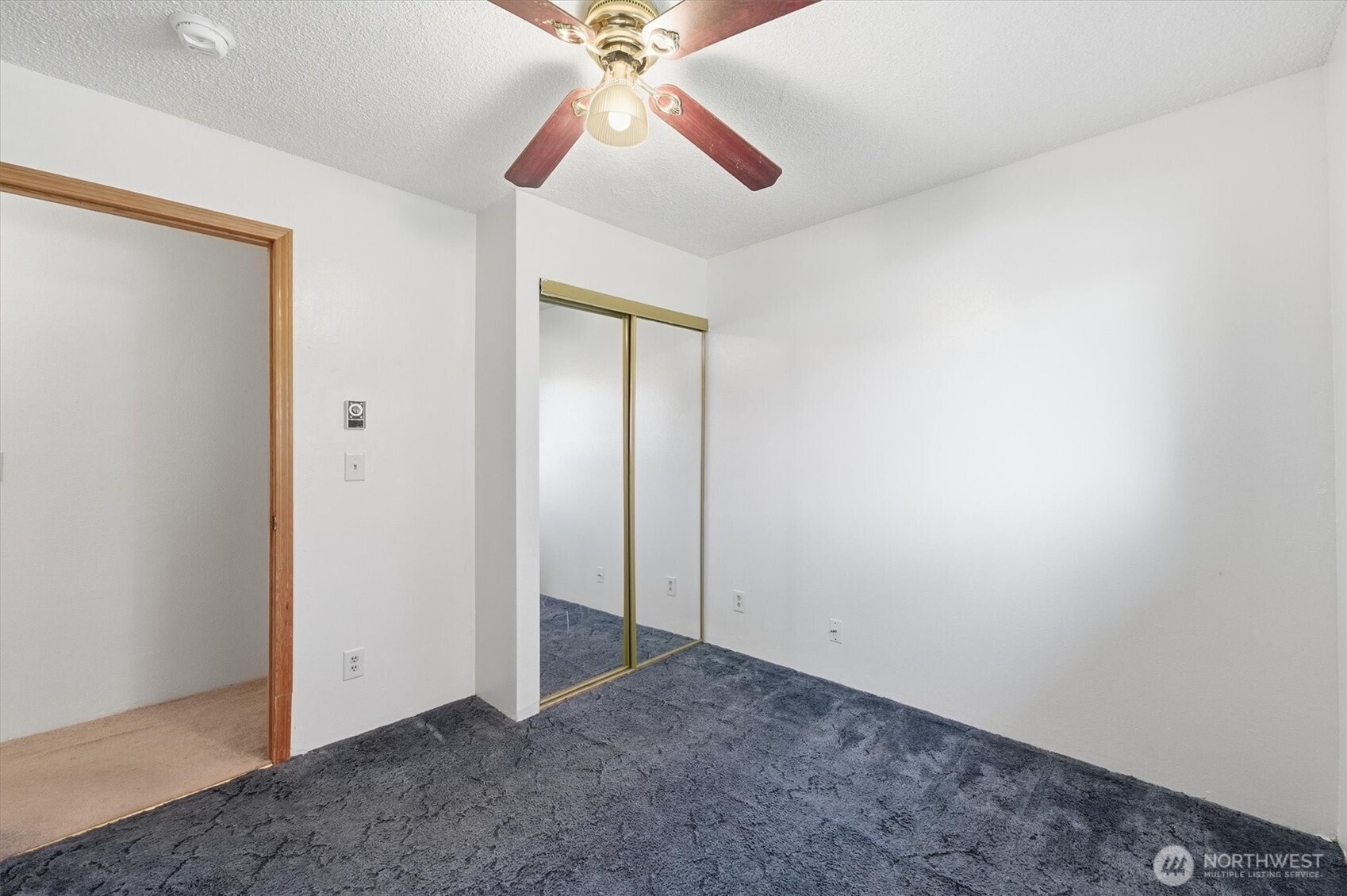 4759 Windemere Street Longview, WA 98632 - Photo 21 of 38 an empty room with a chandelier fan