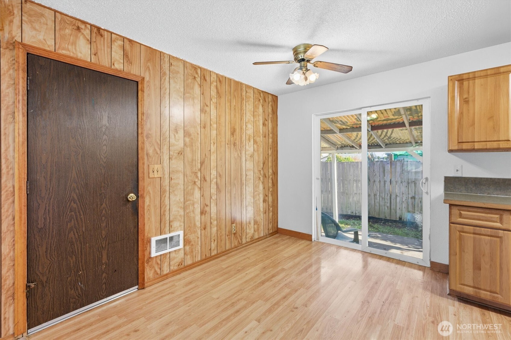 4759 Windemere Street Longview, WA 98632 - Photo 8 of 38 a view of a livingroom with wooden floor and a ceiling fan