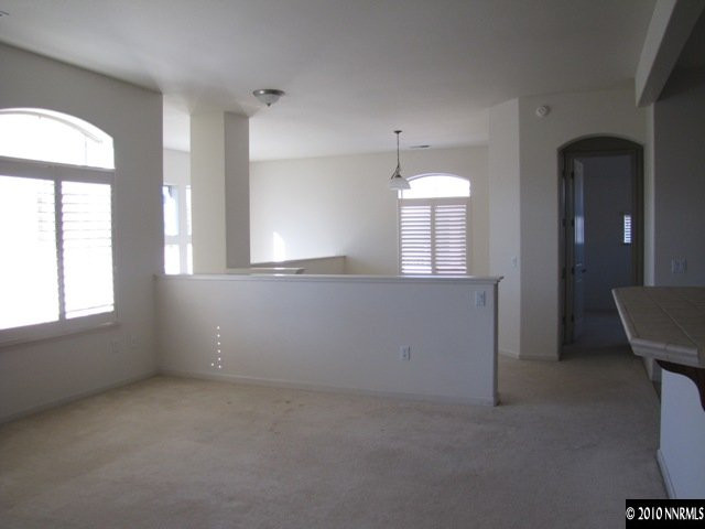 9900 Wilbur May Parkway, Unit 3405 Reno, NV 89521 - Photo 7 of 12 an empty room with a empty space and windows