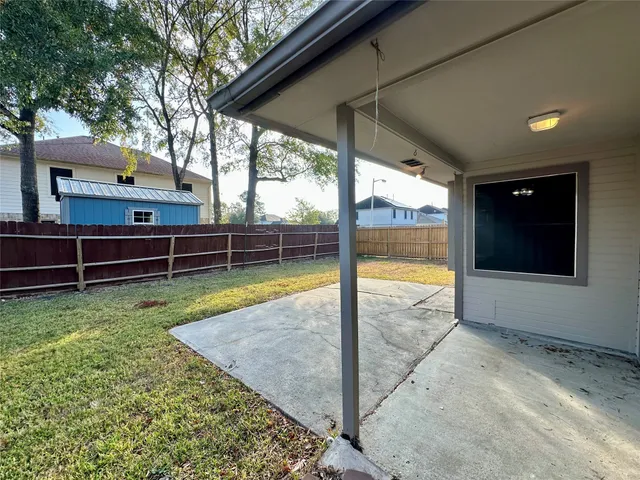 a house with trees in the background