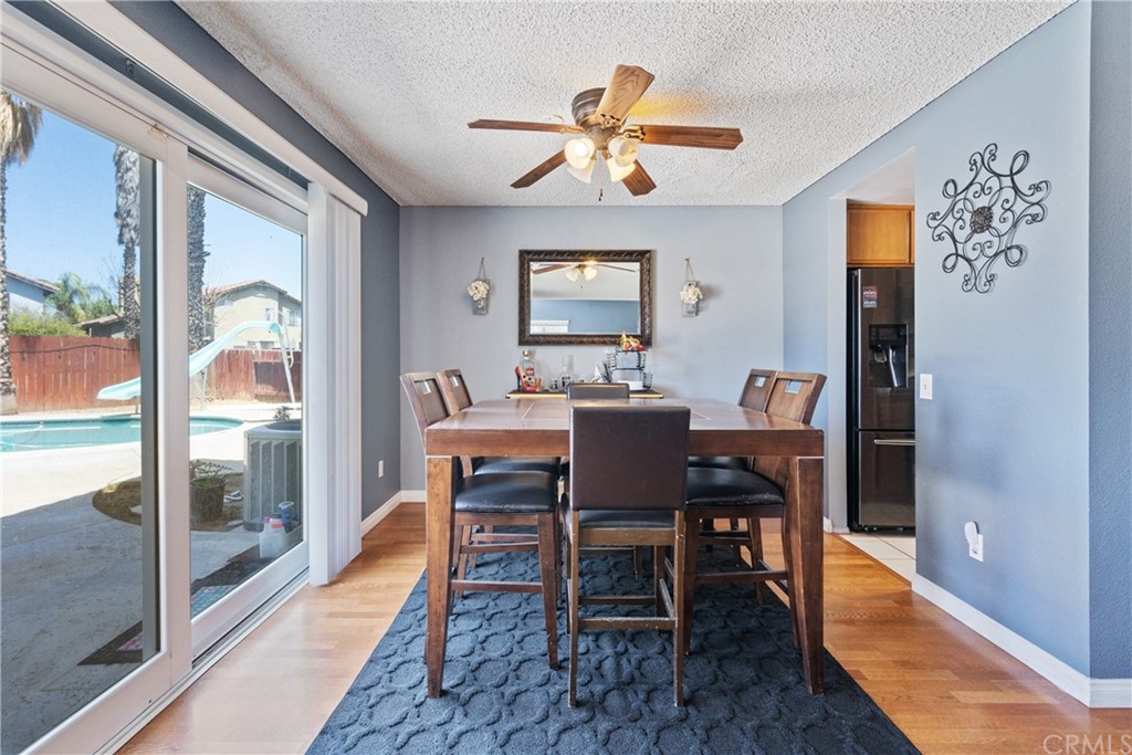 782 De La Luz Circle Perris, CA 92571 - Photo 11 of 25 a view of a dining room with furniture window and outside view