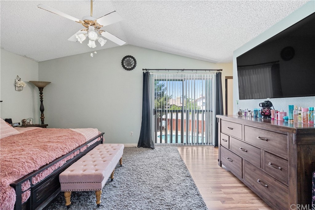 782 De La Luz Circle Perris, CA 92571 - Photo 16 of 25 a bed room with a bed and a tv