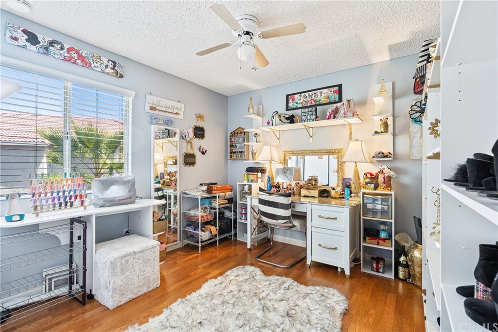 782 De La Luz Circle Perris, CA 92571 - Photo 18 of 25 a living room with furniture and wooden floor