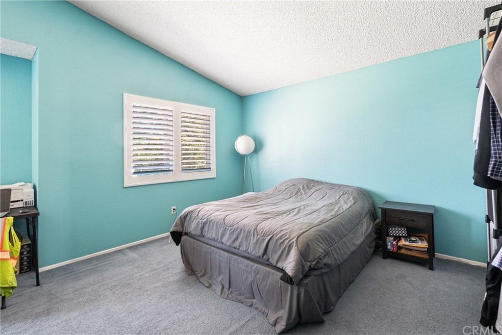 782 De La Luz Circle Perris, CA 92571 - Photo 23 of 25 a bedroom with a bed and a window