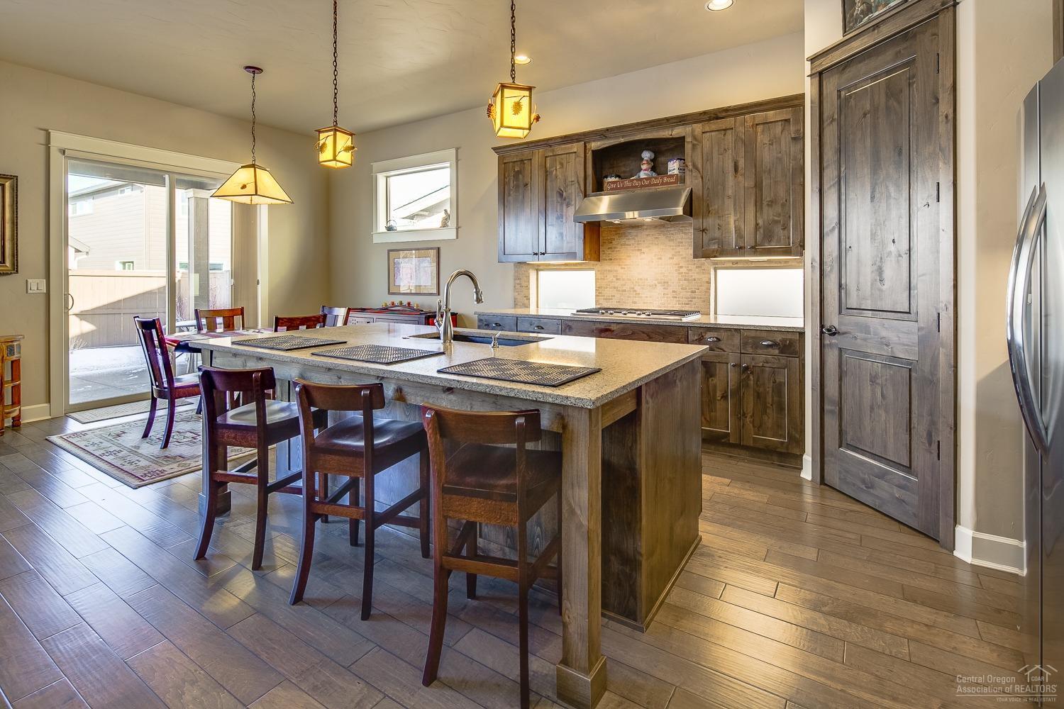 61121 Manhae Loop Bend, OR 97702 - Photo 5 of 24 Large kitchen island with granite counte