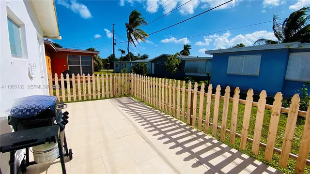 a view of a chair and table in the balcony