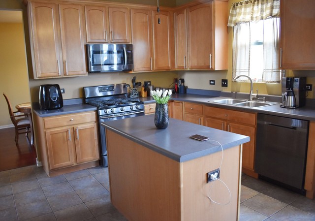 1923 Brimstone Road Romeoville, IL 60446 - Photo 3 of 14 a kitchen with stainless steel appliances granite countertop a sink stove and microwave