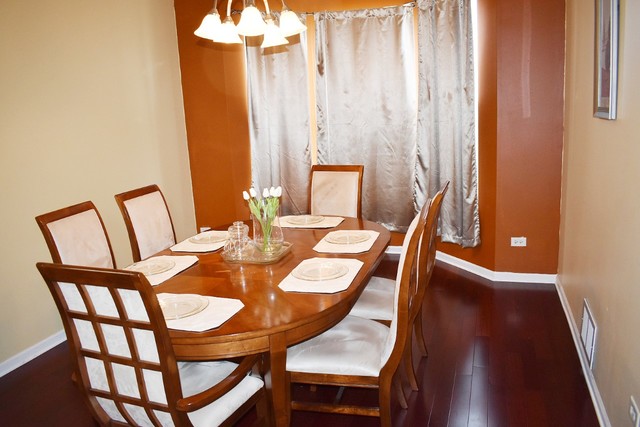 1923 Brimstone Road Romeoville, IL 60446 - Photo 5 of 14 a view of a dining room with furniture and wooden floor