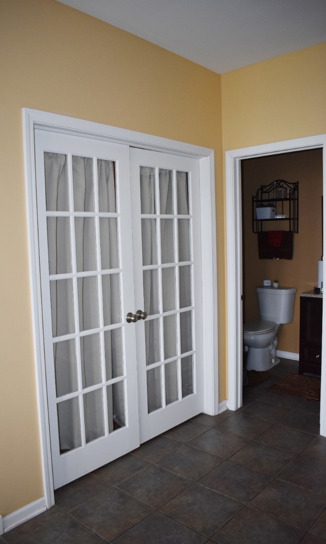 1923 Brimstone Road Romeoville, IL 60446 - Photo 8 of 14 a view of an empty room with a window