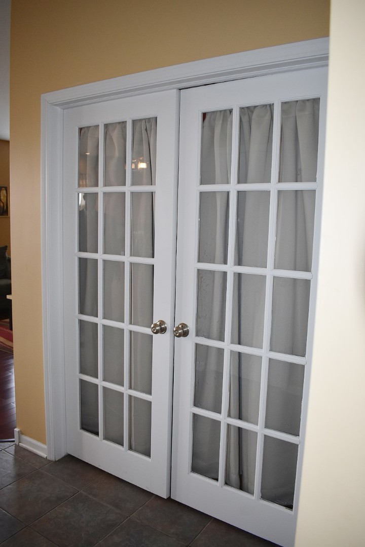 1923 Brimstone Road Romeoville, IL 60446 - Photo 9 of 14 a view of an empty room with wooden floor and a window