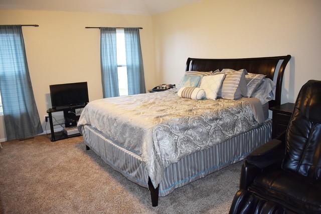1923 Brimstone Road Romeoville, IL 60446 - Photo 10 of 14 a bed sitting in a bedroom next to a window with pc on the wall