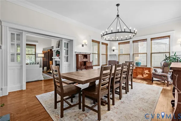 a kitchen with a sink cabinets and wooden floor