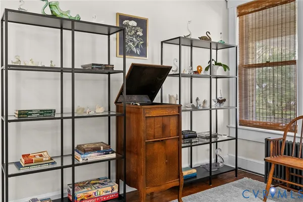 a living room with furniture a window and a chandelier