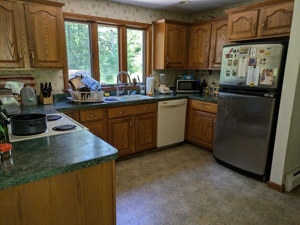10 Sassawanna Road Rutland, MA 01543 - Photo 8 of 14 a kitchen with granite countertop a sink stove and cabinets