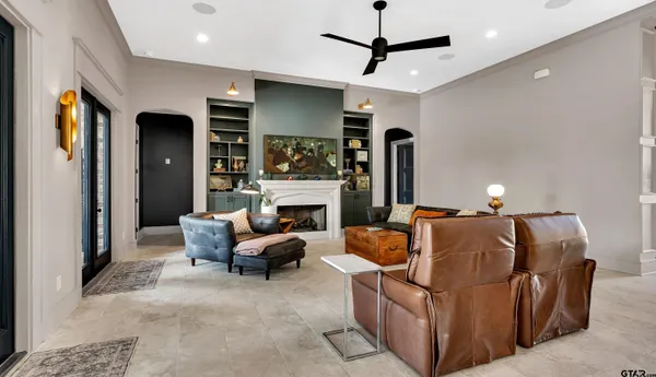 a living room with furniture and a fireplace
