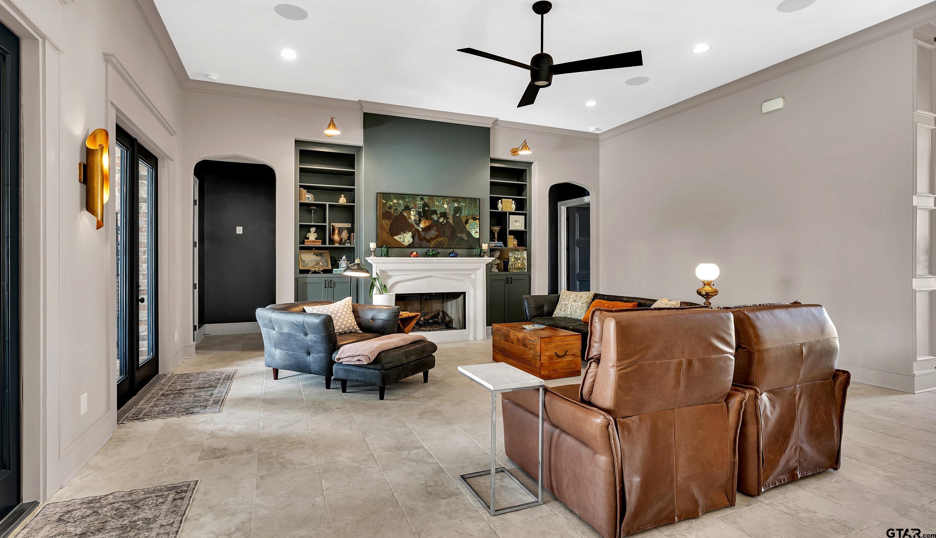 a living room with furniture and a fireplace