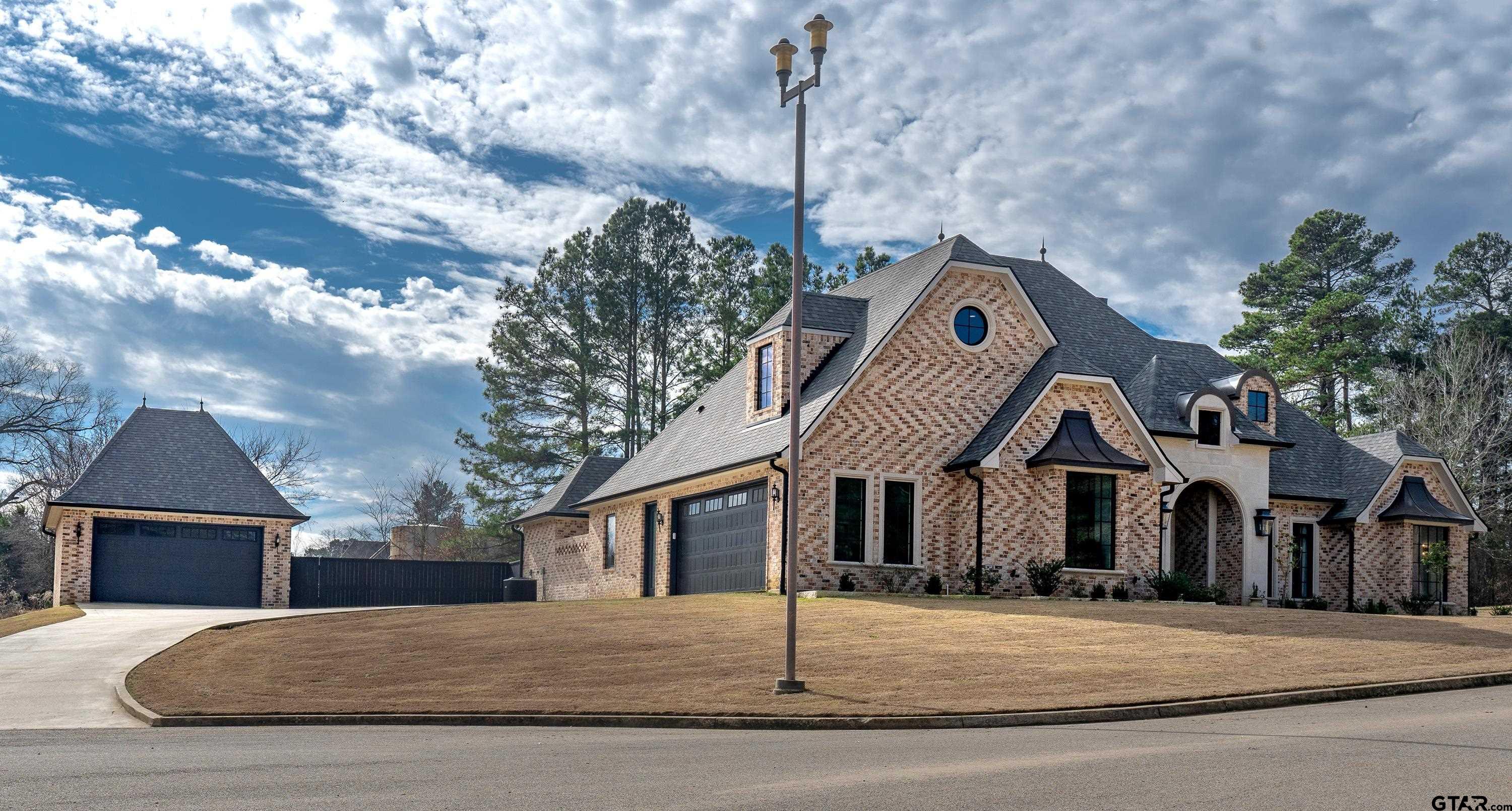500 Roberts Circle Longview, TX 75605 - Photo 39 of 48 a front view of a house with a yard and garage