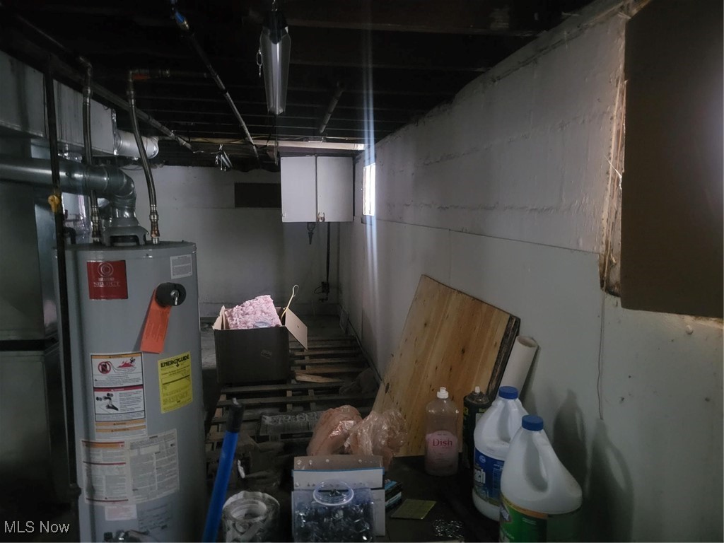 7631 Mines Road Southeast Warren, OH 44484 - Photo 17 of 22 Unfinished basement featuring water heater
