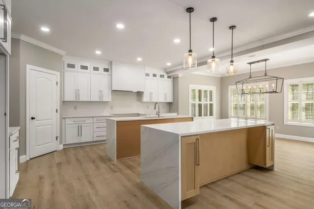a large kitchen with lots of counter space sink and appliances