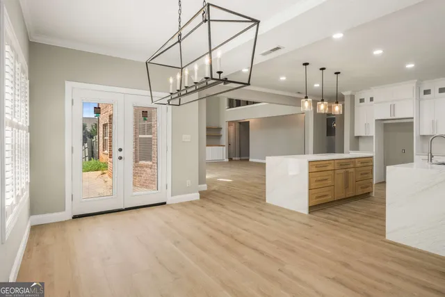 a view of a refrigerator in kitchen and wooden floor