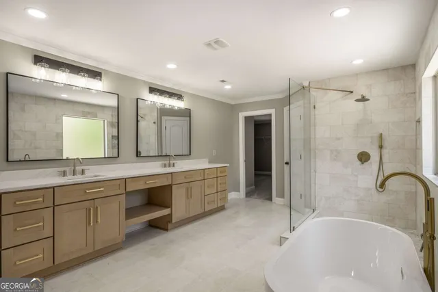 a bathroom with a tub sink shower and mirror